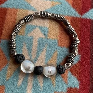 Lava bead eo bracelet with silver and clear glass beads. Elastic. Good condition